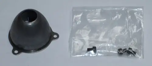 Daikin-Luftdüse aus Metall in konischer Form mit Öffnung oben, daneben eine transparente Tüte mit Schrauben.